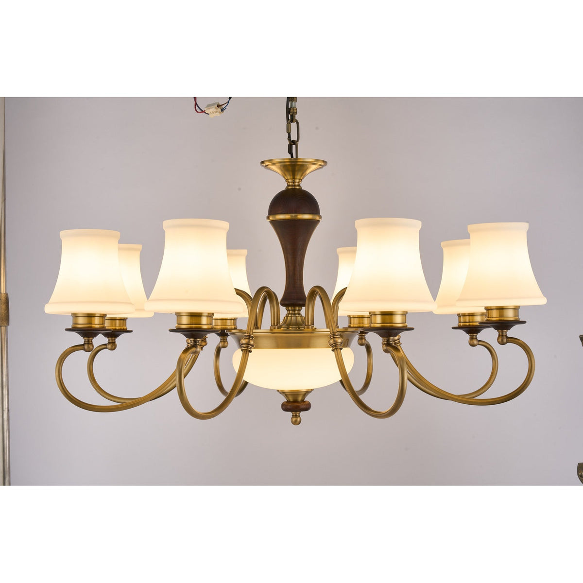 
Supplier real photograph of the Glenhaven eight-light chandelier complete lit front view